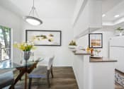 Thumbnail 33 of 61 - a kitchen and dining area in a 555 waverly unit