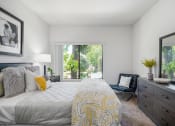 Thumbnail 36 of 61 - a bedroom with a large bed and a large window