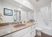 Thumbnail 39 of 61 - a bathroom with a sink and a toilet
