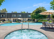 Thumbnail 17 of 61 - our apartments have a resort style swimming pool with umbrellas