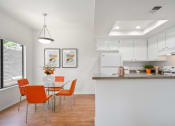 Thumbnail 6 of 61 - a kitchen and dining area in a 555 waverly unit