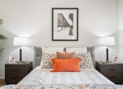 Thumbnail 10 of 61 - a bedroom with a bed and two night stands with lamps on them