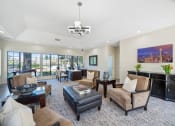 Thumbnail 20 of 61 - a living room filled with furniture and a large window