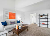 Thumbnail 1 of 41 - a living room with a couch and a coffee table