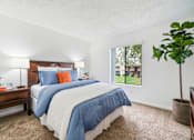 Thumbnail 8 of 41 - a bedroom with a bed and a window