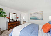 Thumbnail 9 of 41 - a bedroom with a bed and a dresser