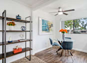 Thumbnail 3 of 41 - a dining room with a table and chairs and a ceiling fan