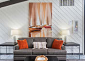 Thumbnail 31 of 41 - a living room with a couch and a painting on the wall