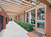 Thumbnail 40 of 41 - the entrance to a building with a walkway and awning