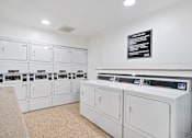 Thumbnail 35 of 41 - the laundry room is equipped with washes and dryers