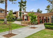 Thumbnail 34 of 41 - an exterior view of a building with trees and a sidewalk