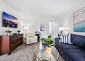 Thumbnail 6 of 28 - a living room with white walls and carpet