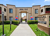 Thumbnail 28 of 28 - The entrance to the Nogal Feliz Apartment Homes is decorated with balloons.