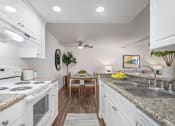 Thumbnail 24 of 29 - a kitchen and dining area in a 555 waverly unit