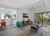 Thumbnail 5 of 40 - a living room with a couch and a coffee table