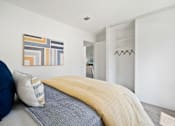 Thumbnail 18 of 36 - a bedroom with a bed and a closet