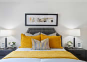 Thumbnail 11 of 38 - a bedroom with a yellow bed and yellow pillows