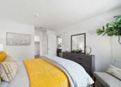 Thumbnail 10 of 38 - a bedroom with a yellow bed and a yellow blanket