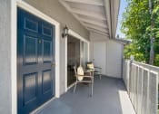 Thumbnail 38 of 38 - a blue door is open to a porch with a chair