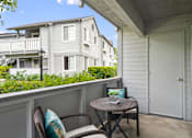Thumbnail 49 of 49 - a patio with two chairs and a small table on a balcony