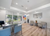 Thumbnail 2 of 38 - the living room of a home with a desk and chairs