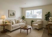 Thumbnail 2 of 16 - A living room with a couch, chair, and table.
