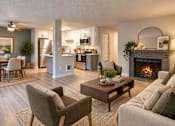 Thumbnail 4 of 13 - A living room with a fireplace and a dining table.
