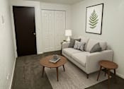 Thumbnail 7 of 27 - A living room with a couch, coffee table, and lamp.