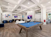 Thumbnail 27 of 42 - a games room with a pool table in the middle