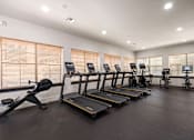 Thumbnail 21 of 42 - the gym is equipped with cardio equipment and weights