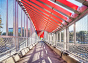 Thumbnail 40 of 42 - a bridge with an orange and white bridge
