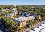 Thumbnail 1 of 42 - an aerial view of a building with a parking lot and a bridge