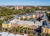 Thumbnail 42 of 42 - an aerial view of a building with a city in the background