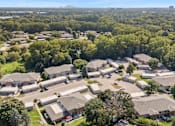 Thumbnail 11 of 15 - A bird's eye view of a residential area with houses and trees.