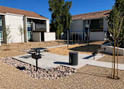 Thumbnail 7 of 20 - A courtyard with a bench, a trash can, and a fire hydrant.