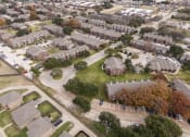 Thumbnail 20 of 35 - An aerial view of a neighborhood of houses in a suburb