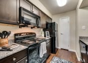 Thumbnail 8 of 35 - Mount Vernon Apartments | Desoto TX | Modern Kitchen with Granite Countertops