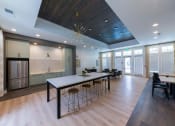 Thumbnail 9 of 12 - Nathan Ridge Apartments - Clubroom with Kitchen and TVs