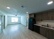 Thumbnail 9 of 24 - Gavin Point Apartments | Jacksonville, FL | Kitchen & Living Area