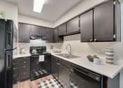 Thumbnail 15 of 47 - The Park at Wintergreen Apartments | DeSoto, TX  | Kitchen