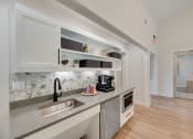 Thumbnail 1 of 47 - The Park at Wintergreen Apartments | DeSoto, TX  | Clubhouse Kitchen