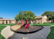 Thumbnail 39 of 47 - The Park at Wintergreen Apartments | DeSoto, TX | Playground and Jogging Path