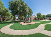 Thumbnail 42 of 47 - The Park at Wintergreen Apartments | DeSoto, TX | Playground and Jogging Path
