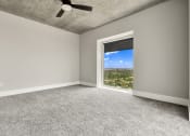 Thumbnail 86 of 114 - Empty room with expansive city skyline visible through a large window in Houston, TX