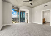 Thumbnail 87 of 114 - Allure Hermann Park | Penthouse Bedroom with City Views