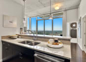 Thumbnail 70 of 114 - Allure Hermann Park | 2 Bedroom Model Kitchen