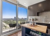 Thumbnail 75 of 114 - Allure Hermann Park | Spacious 1 Bedroom Model Kitchen with City Views