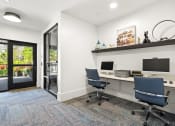 Thumbnail 42 of 60 - a white office with two desks and two computer monitors
