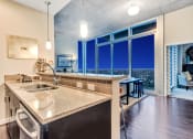 Thumbnail 14 of 114 - Allure Hermann Park | Kitchen with Stainless Steel Appliances