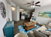 Thumbnail 4 of 46 - a living room with a couch and a coffee table